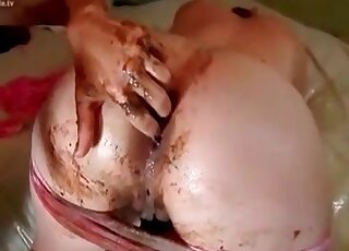 Shaved pussy getting gaped while covered in doodoo