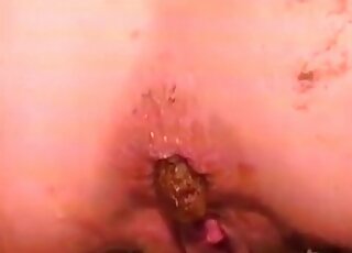 Man eating poop from the body of the dominatrix