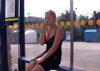 The shaved pussy of a fit blonde is pissing outdoors