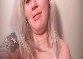 Tattooed blonde woman loves showcasing her features