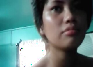 Chubby Asian woman masturbating while she is squatting