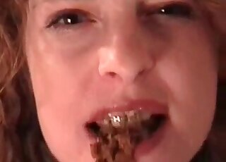 Dildo covered in feces is going in and out